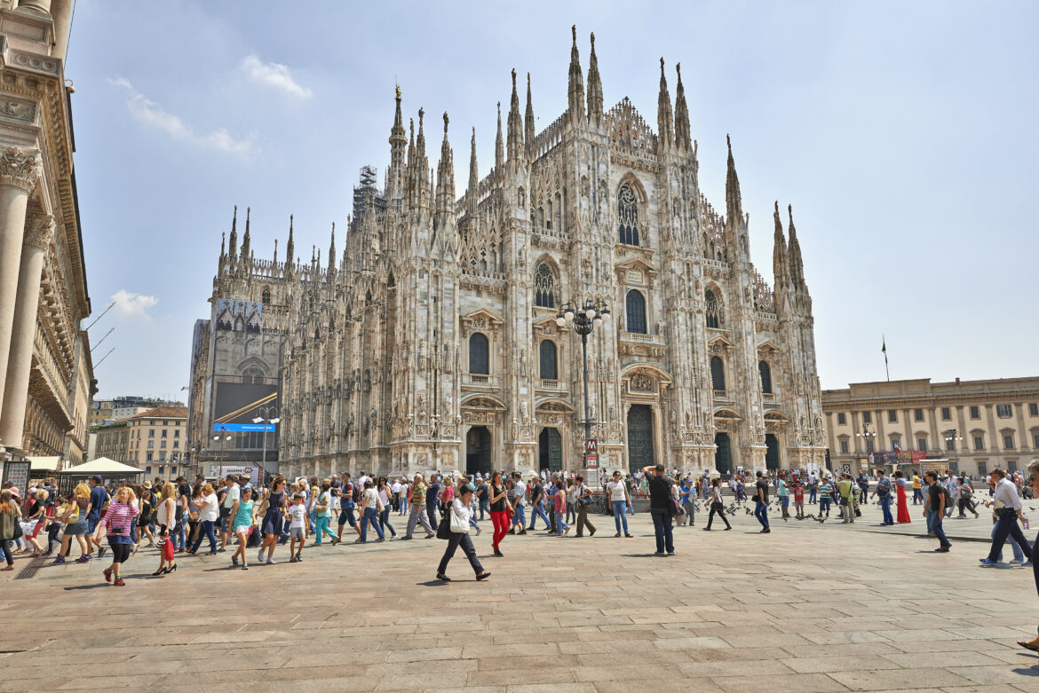 Tourists at The Duomo cathedral from Milan, Italy