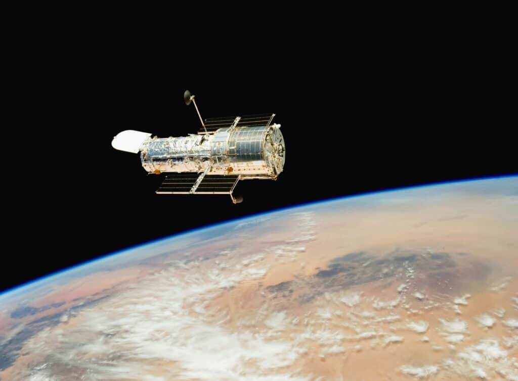an image of a satellite above the earth