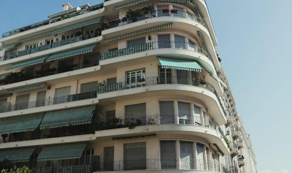 A tall building with balconies and balconies on the top of it