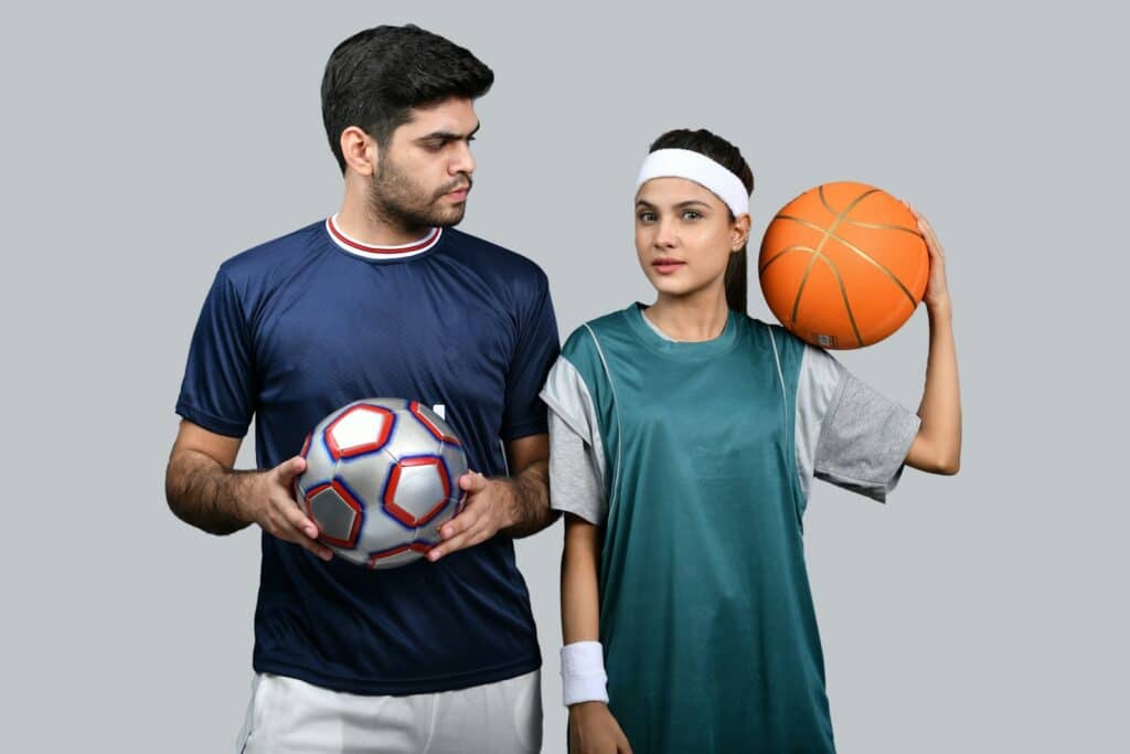 a man and a woman holding a basketball